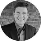 Black and white headshot of co-founder John McColl